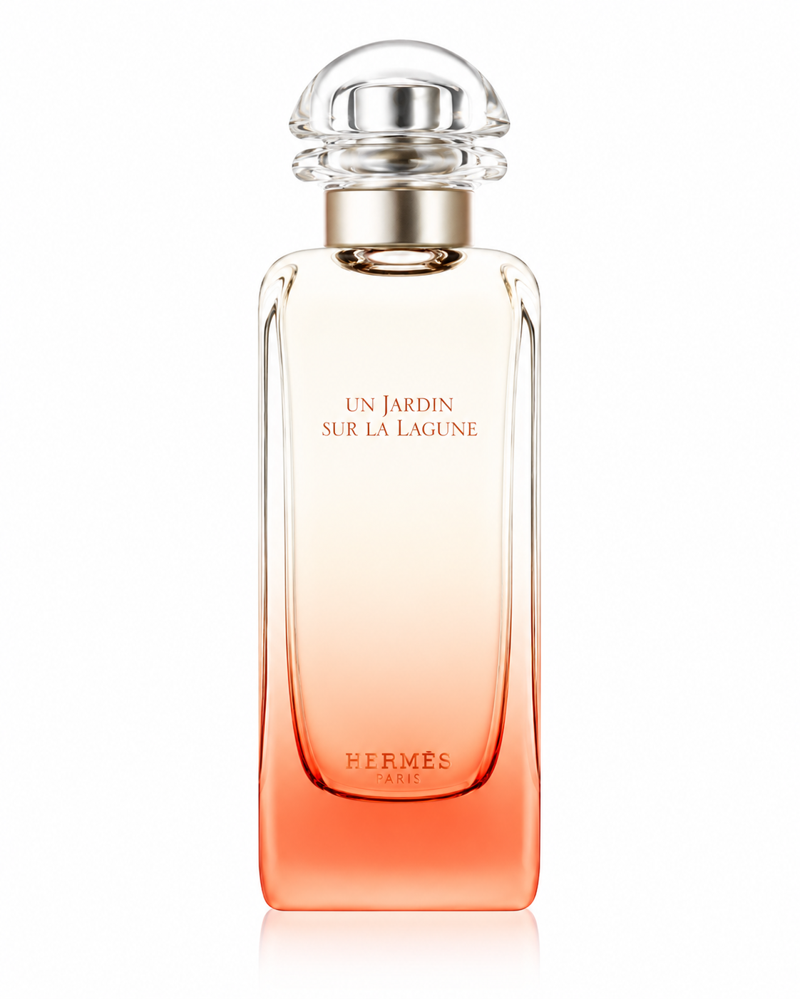 Hermès Un Jardin Sur La Lagune Eau de Toilette perfume bottle isolated on a white background, featuring a tall clear glass bottle with a soft coral gradient base, rounded transparent cap, and elegant minimalist Hermès design.