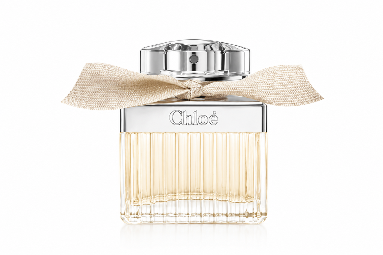 Chloé perfume bottle with a ribbed clear glass body, pale yellow liquid, a silver cap, and a beige ribbon bow tied around the neck, shown on a white background.
