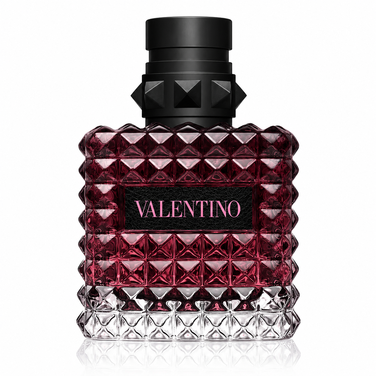 Valentino Donna Born In Roma Intense Eau de Parfum presented in its iconic Rockstud-inspired faceted glass bottle with deep burgundy-to-clear gradient glass, luxurious black studded cap and elegant Valentino plaque. Displayed on a flawless pure white background with premium studio lighting, crystal-clear reflections, soft natural shadows and exceptional detail that emphasizes the couture-inspired bottle design. A clean, elegant and photorealistic luxury e-commerce presentation.