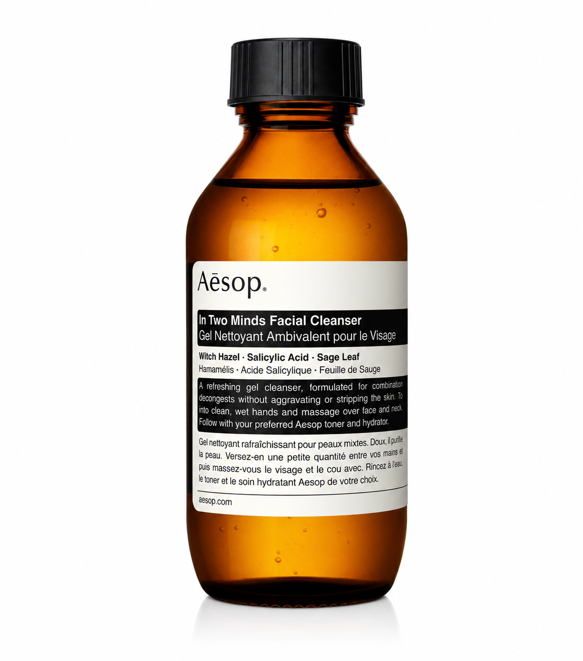 Aesop In Two Minds Facial Cleanser in a signature amber plastic bottle with a black flip-top cap and Aesop's minimalist white label, isolated on a white background. This refreshing gel facial cleanser is formulated for combination skin with witch hazel, salicylic acid, and sage leaf to gently cleanse, decongest pores, and remove excess oil without stripping the skin, while showcasing Aesop's iconic apothecary-inspired packaging.