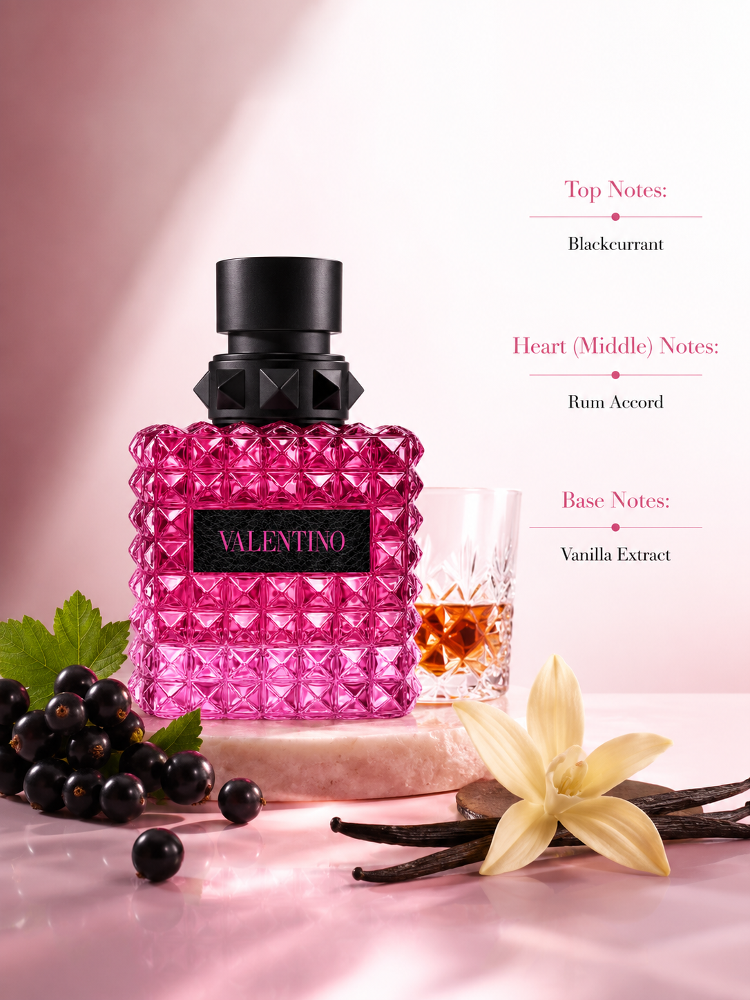 Valentino Born in Roma Donna Pink PP Eau de Parfum displayed with fragrance notes, surrounded by blackcurrants, vanilla pods, and a rum-inspired glass, highlighting its gourmand fruity scent with juicy blackcurrant, warm rum accord, and creamy vanilla extract.