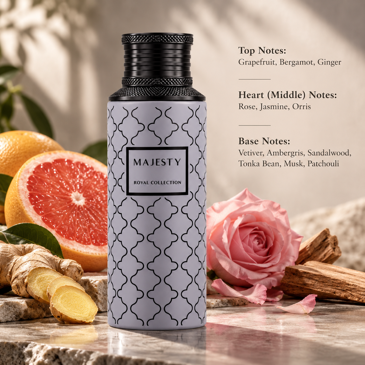 Maison Asrar Majesty Royal Collection 100ml Eau de Parfum displayed on elegant beige marble with fresh grapefruit, ginger, a delicate pink rose and sandalwood. A luxurious citrus floral woody fragrance featuring bergamot, jasmine, orris, ambergris, vetiver, musk and patchouli in a warm, refined setting.